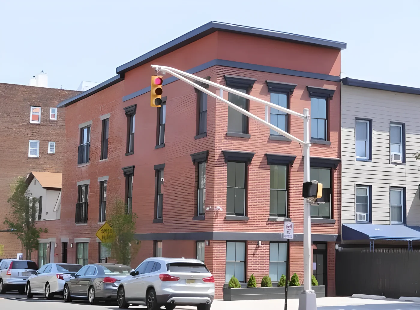 Exterior of a completed HKB building project with brickwork and large windows