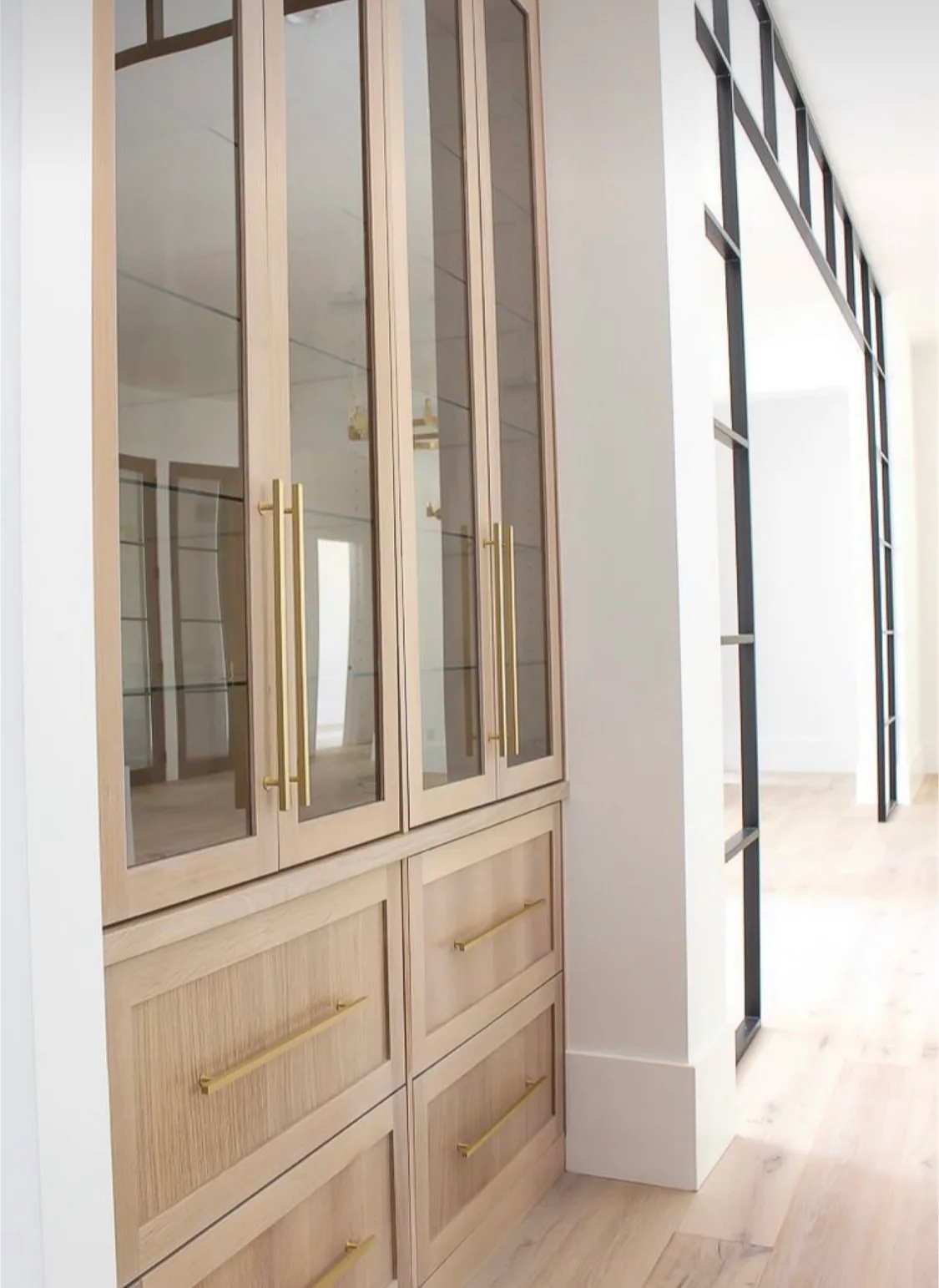 HKB oak built-in cabinetry with glass-front upper doors