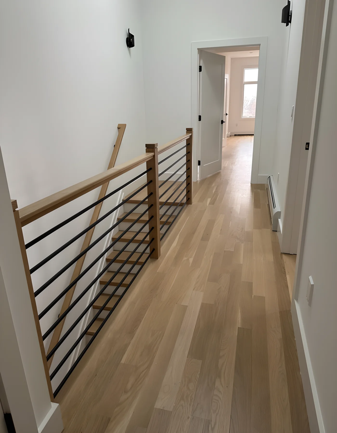 Finished timber flooring and stair rail in an HKB renovation